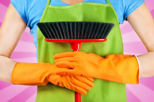 Staff member wearing PPE while cleaning